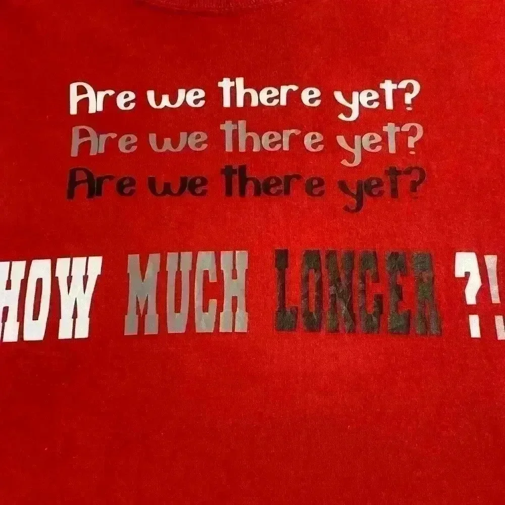 2 Boys T shirts in red ARE WE THERE YET HOW MUCH LONGER sizes Medium & Large.